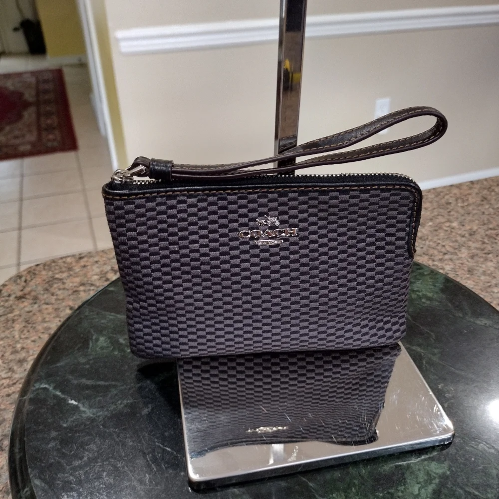 Black and gray checkered Coach Wristlet